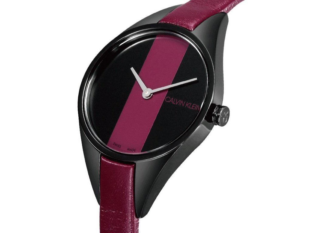Calvin Klein Rebel watch side view with red strap and black dial