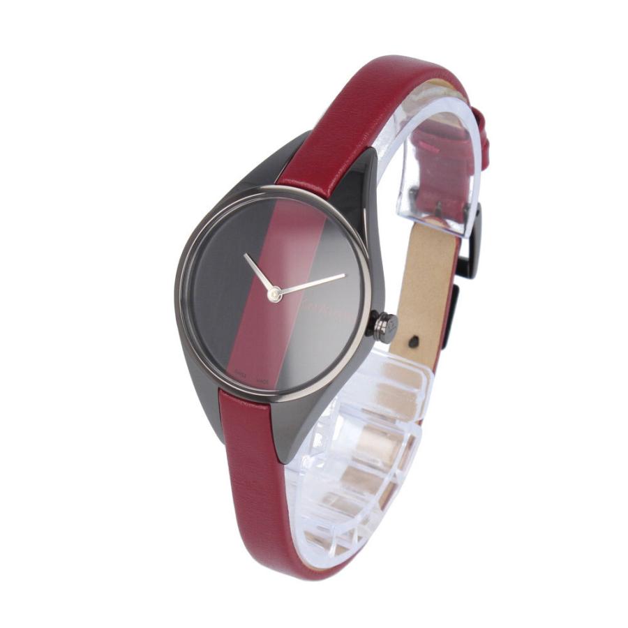 Calvin Klein Rebel watch shown at angle with red leather strap