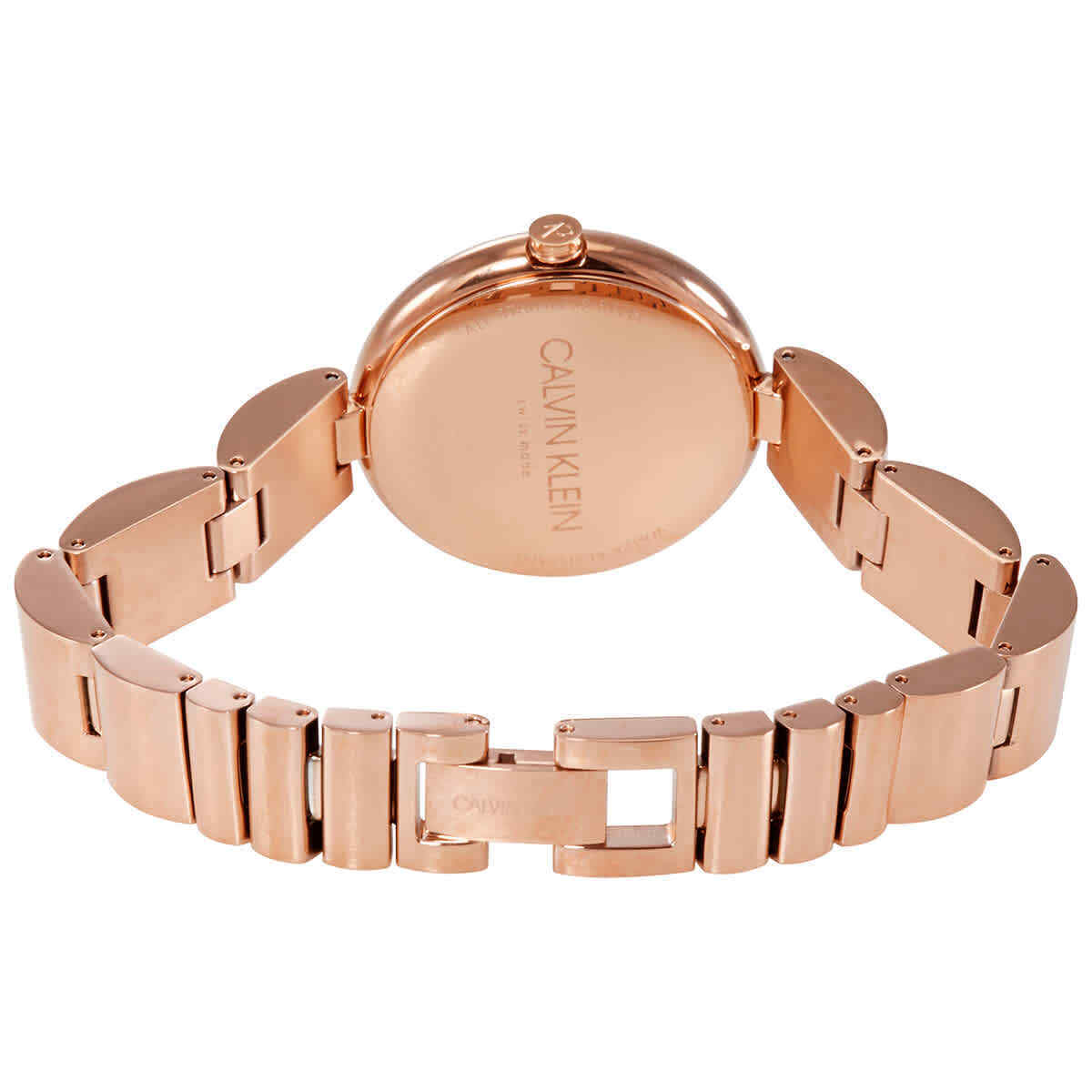 Caseback of Calvin Klein rose gold watch showing engraved design
