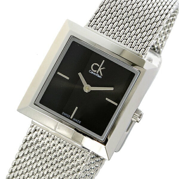 Calvin Klein Mark watch on wrist showing black dial with silver hands and mesh bracelet