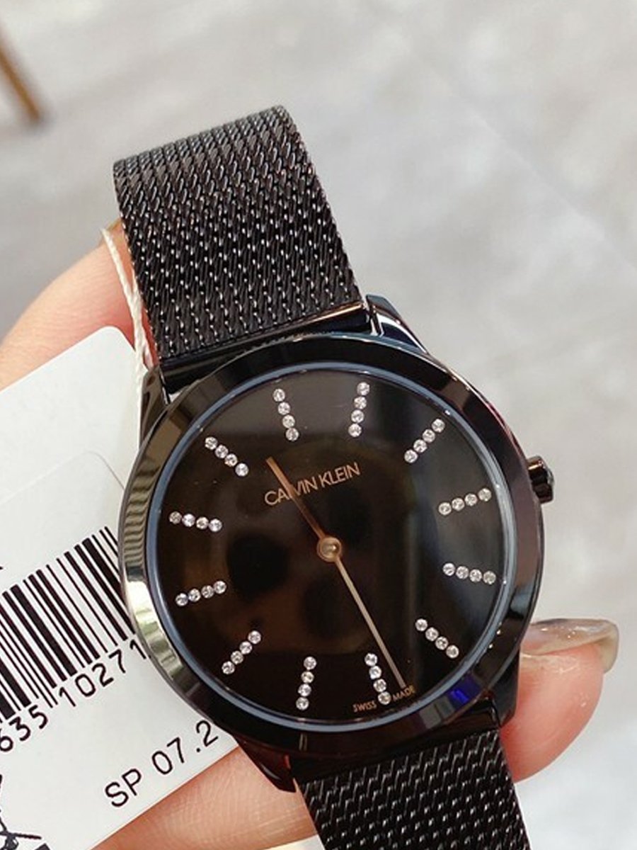 Calvin Klein Minimal Diamonds watch worn on wrist showing black dial and diamond markers