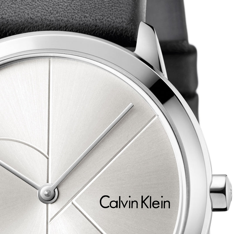 Close-up of Calvin Klein Minimal watch dial with geometric line design and steel case