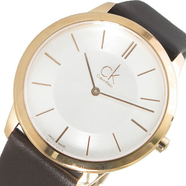 Detailed view of Calvin Klein Minimal dial with rose gold indices, hands, and ck branding