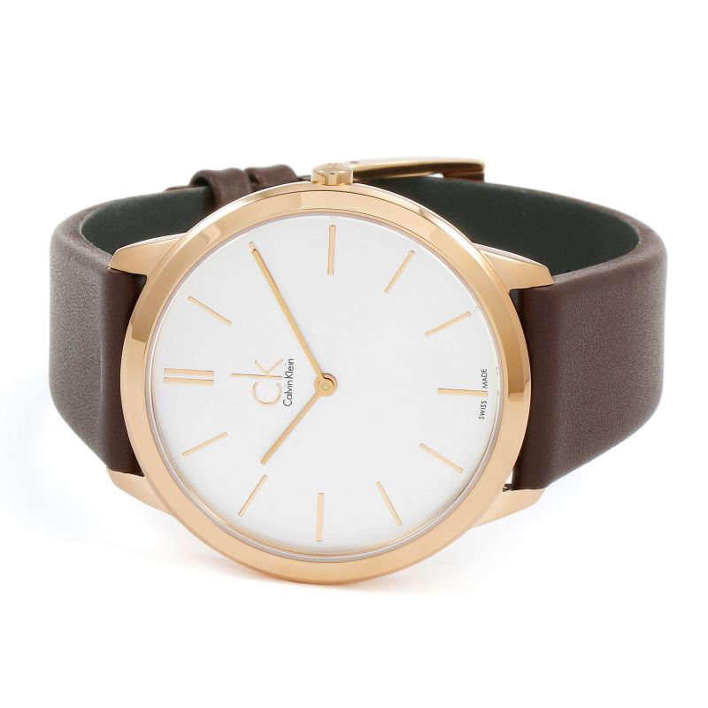 Calvin Klein Minimal men's watch worn on wrist showing rose gold case and brown leather strap