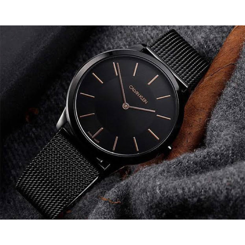 Calvin Klein Minimal K3M234B1 black watch on wrist with black mesh band