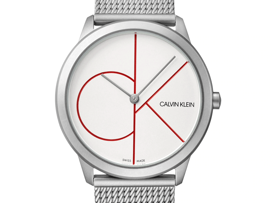 Close-up of white dial with red geometric design and Calvin Klein branding
