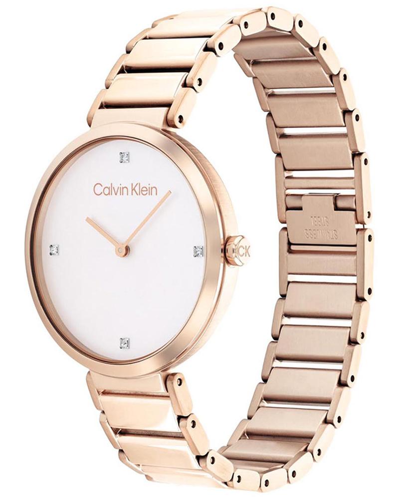 Calvin Klein Minimalistic watch at angle showing white dial and gold-tone link bracelet