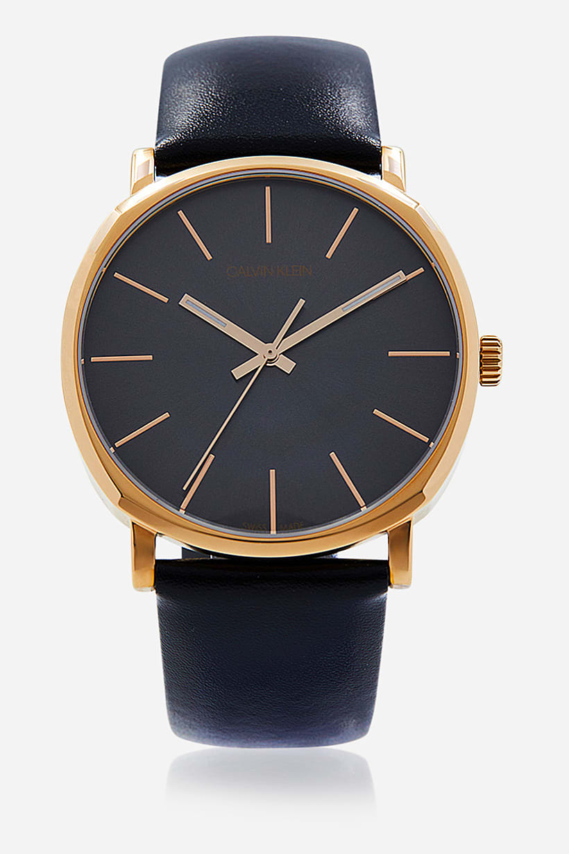 Calvin Klein Posh watch with rose gold case, black dial, and rose gold hour indices
