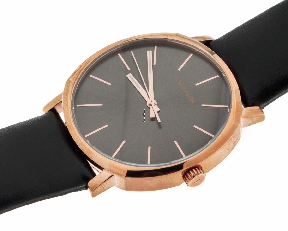 Calvin Klein Posh rose gold watch on wrist with black leather strap