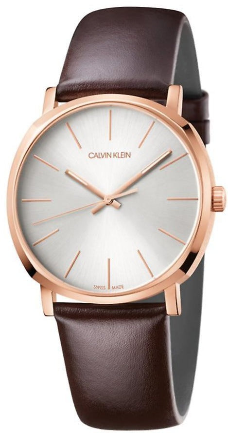 Calvin Klein Posh watch with silver dial, rose gold case, and brown leather strap