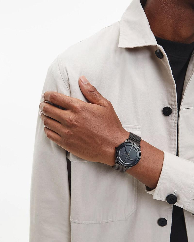 Calvin Klein Rise watch worn on wrist with minimalist black dial design
