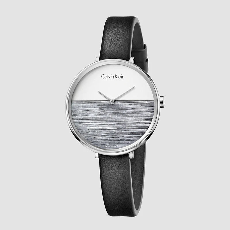 Calvin Klein Rise quartz watch featuring split white and gray dial design with black strap