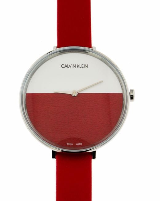 Calvin Klein Rise watch worn on wrist with red leather strap