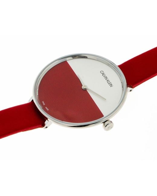Calvin Klein Rise watch side view showing profile with red leather strap and case