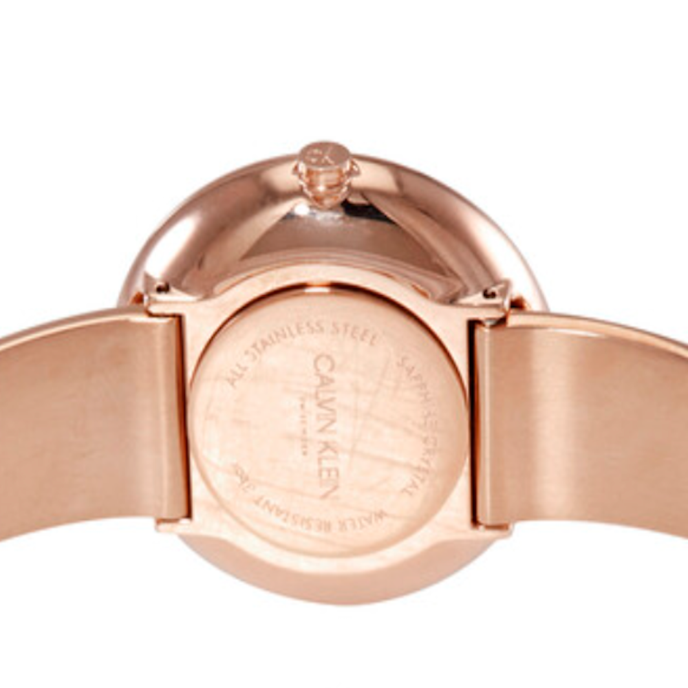 Caseback of Calvin Klein Seduce watch showing stainless steel engraving and Crystal indicators