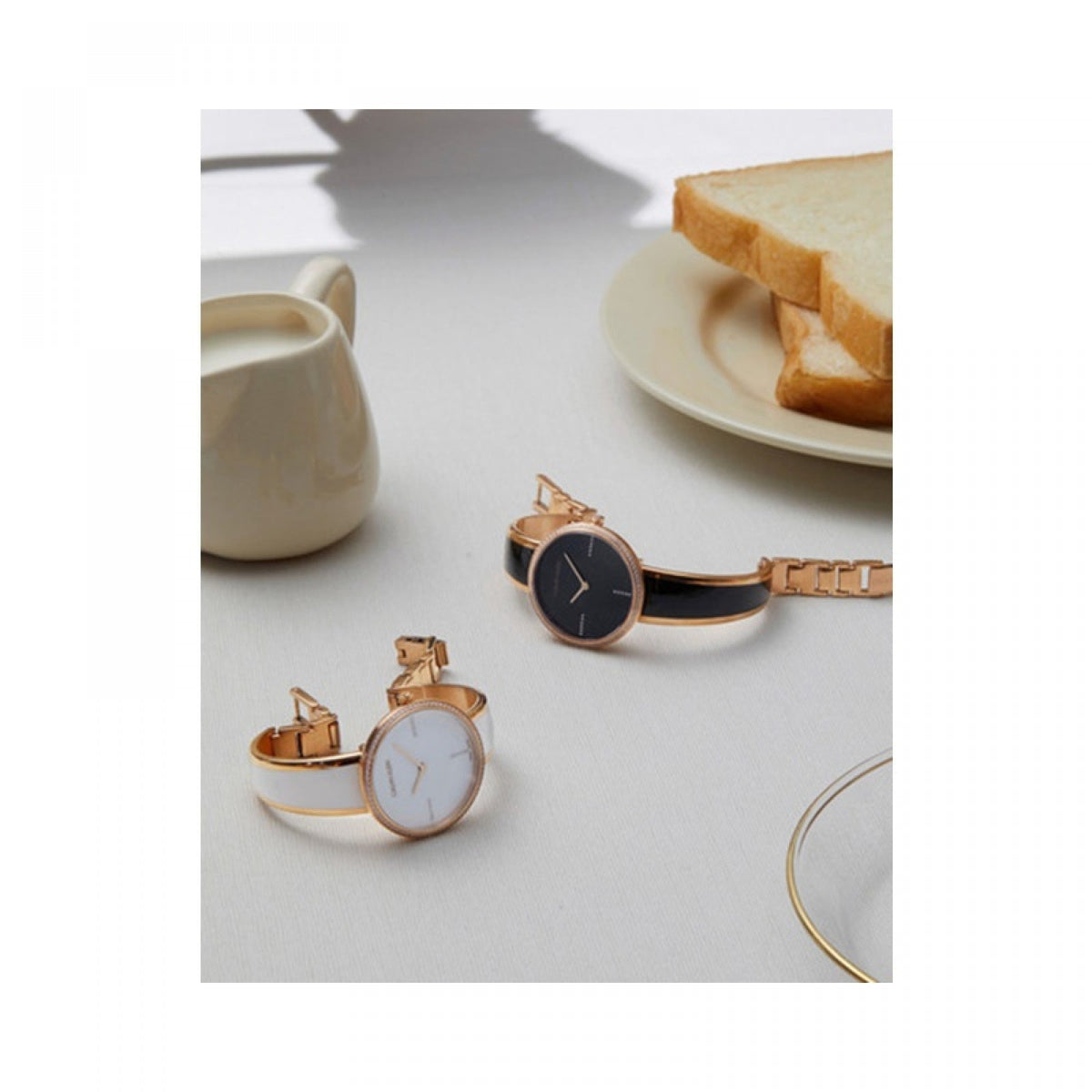 Calvin Klein Seduce watches displayed on white surface with lifestyle elements