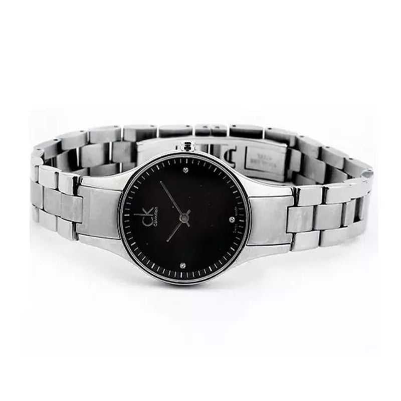 Calvin Klein Simplicity watch overhead angle showing black dial and bracelet