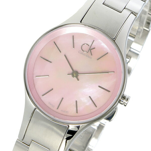 Close-up of Calvin Klein Simplicity K432314E dial showing pink face and silver indices