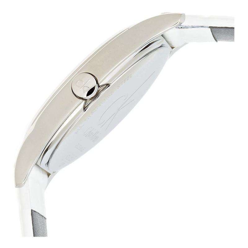 Side profile of Calvin Klein Skirt watch showing stainless steel case and white leather strap