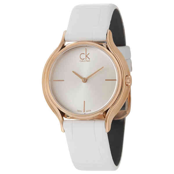 Calvin Klein Skirt watch at angle showing rose gold case with white leather strap