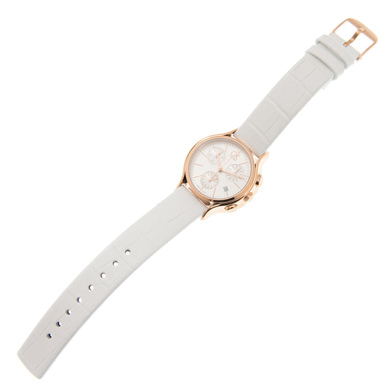 Calvin Klein Skirt chronograph watch on wrist, white leather strap with rose gold buckle