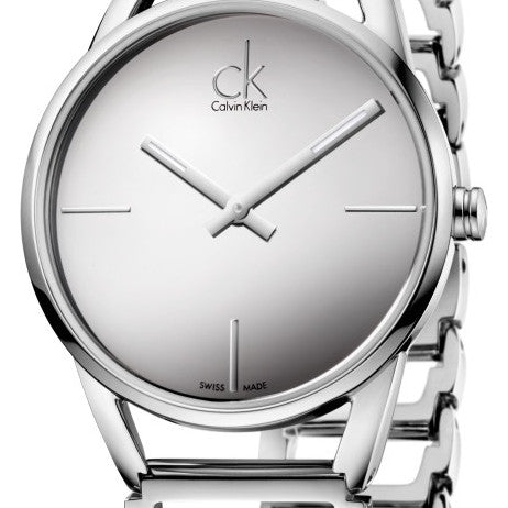 Close-up of Calvin Klein Stately dial with center hour markers and Swiss-made text