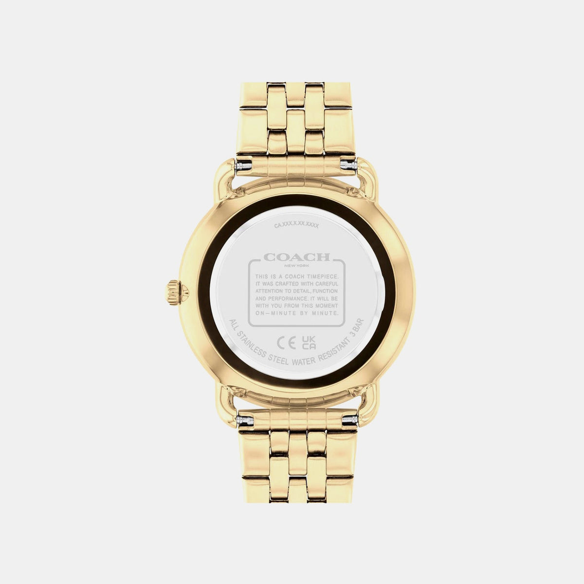 Coach watch caseback showing engraved brand details and watch specifications on white background
