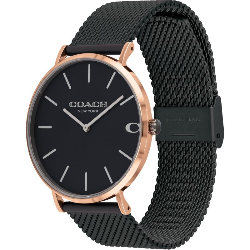 Coach men's watch worn on wrist, displaying rose gold case with black mesh bracelet