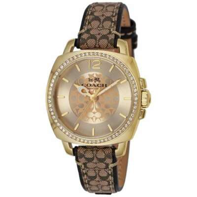 Side angle view of Coach Boyfriend watch showing gold case and brown signature patterned strap