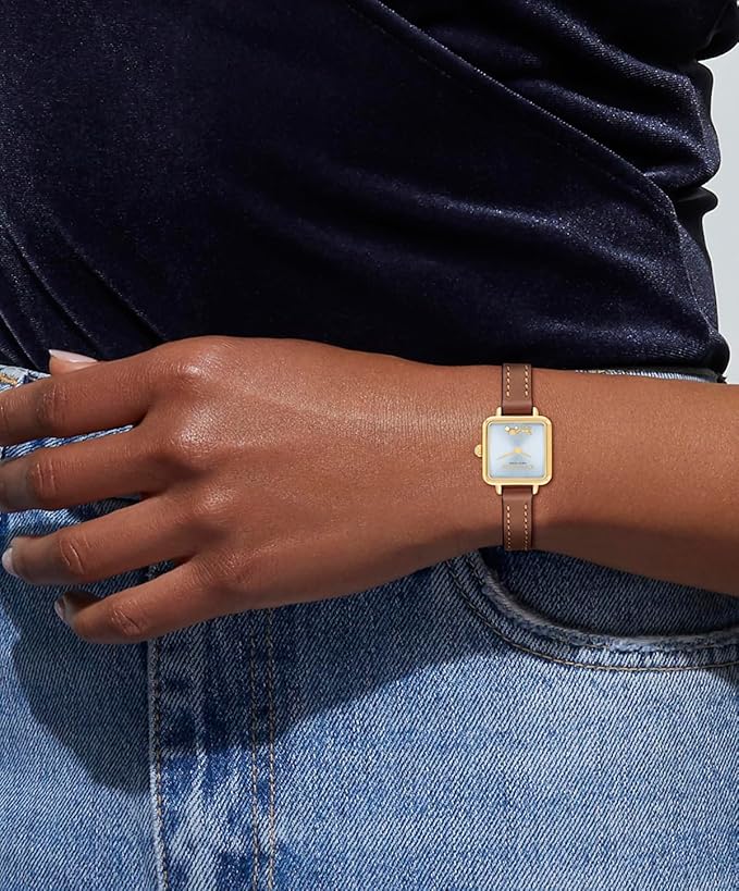 Coach Cass women's watch worn on wrist with gold-tone case and brown leather strap