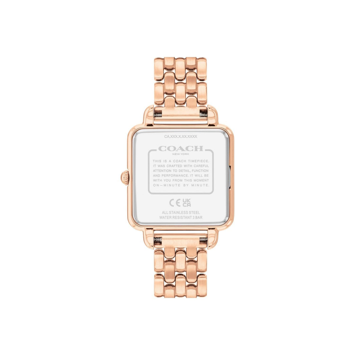 Coach Cass watch caseback showing Coach branding, specifications, and rose gold-tone case
