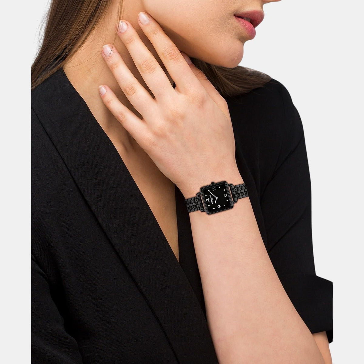 Coach Cass women's watch worn on wrist with black stainless steel bracelet