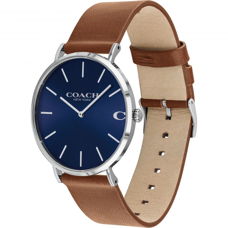 Coach Charles watch on wrist, showing navy dial and brown leather strap detail