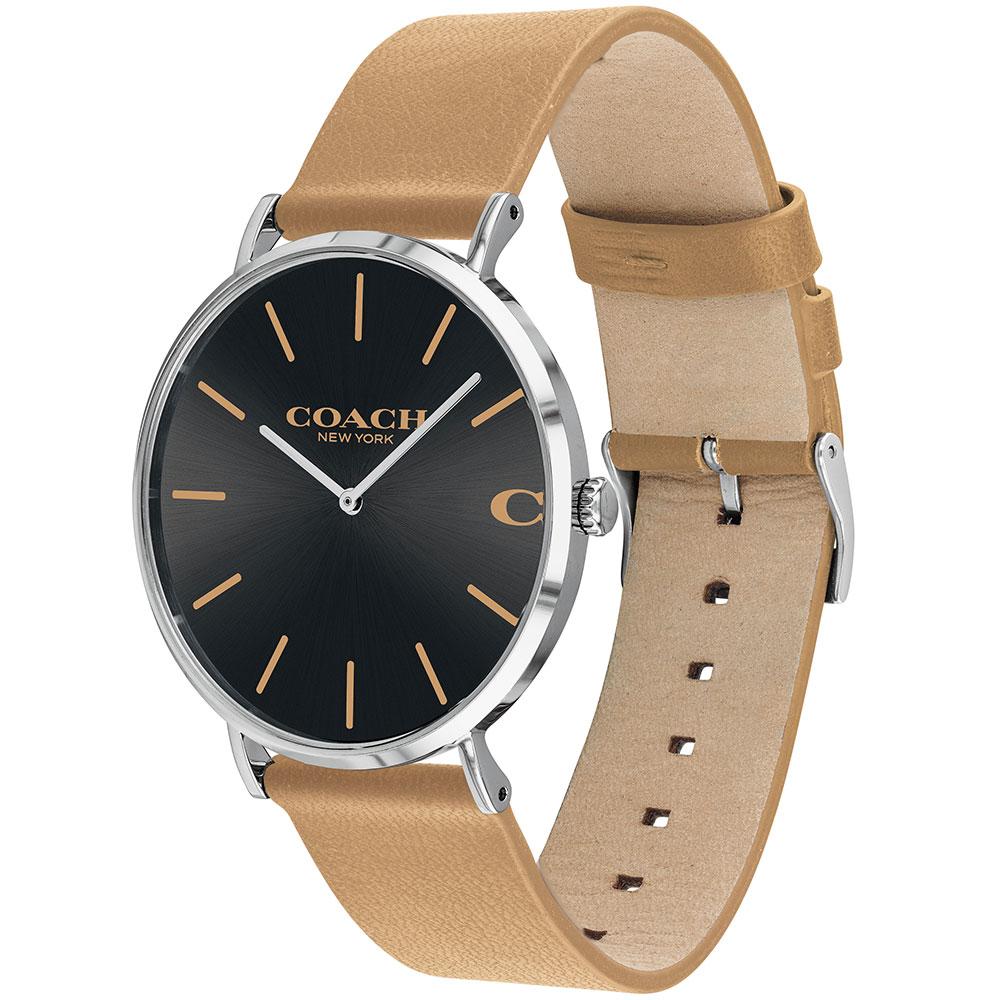 Coach Charles Classic watch on wrist showing black dial and tan leather strap detail