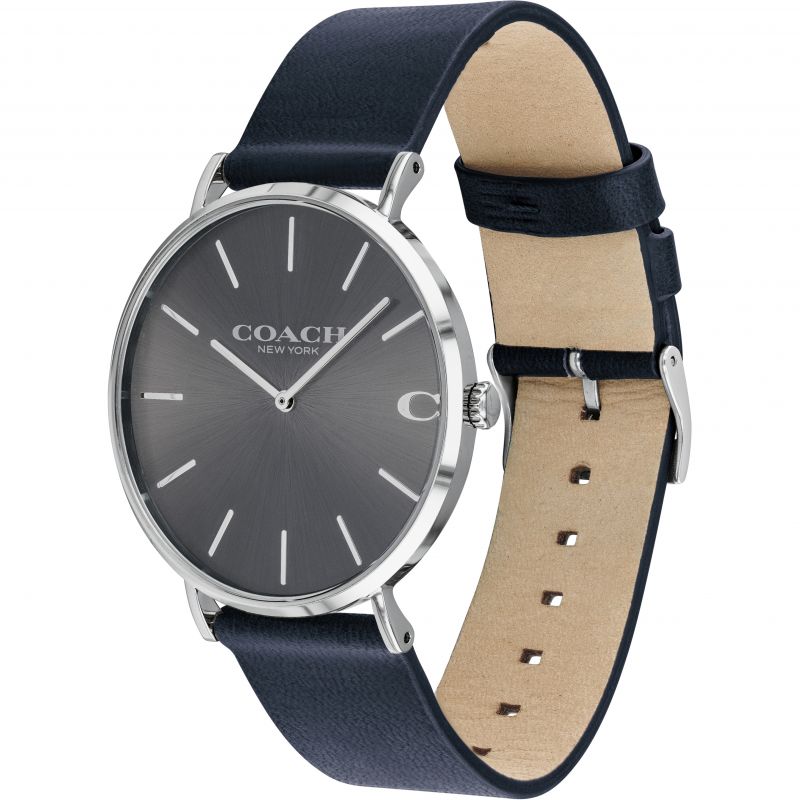 Side angle view of Coach Charles watch showing grey dial and navy leather strap with tan suede backing