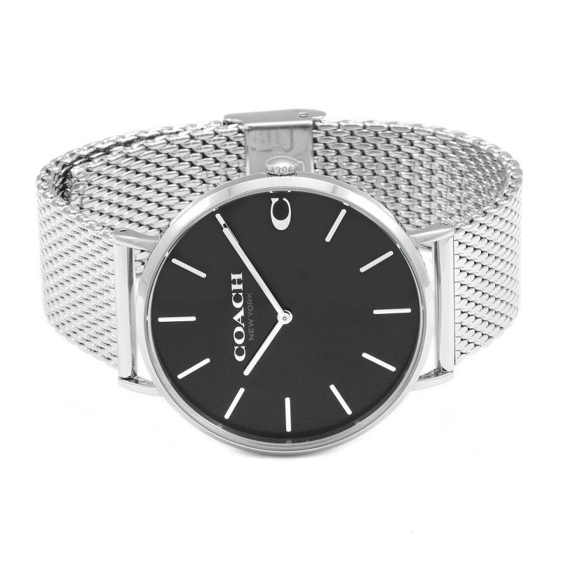 Coach Charles watch with black dial and silver mesh bracelet on wrist