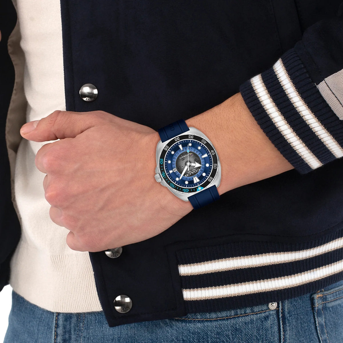 COACH Charter blue dial automatic watch worn on wrist with navy strap