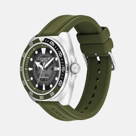 COACH Charter watch angled view showing olive green silicone strap and stainless steel case profile