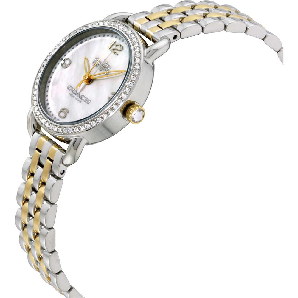 Coach Delancey women's watch on wrist, showing two-tone steel bracelet and white mother of pearl dial with gold hands