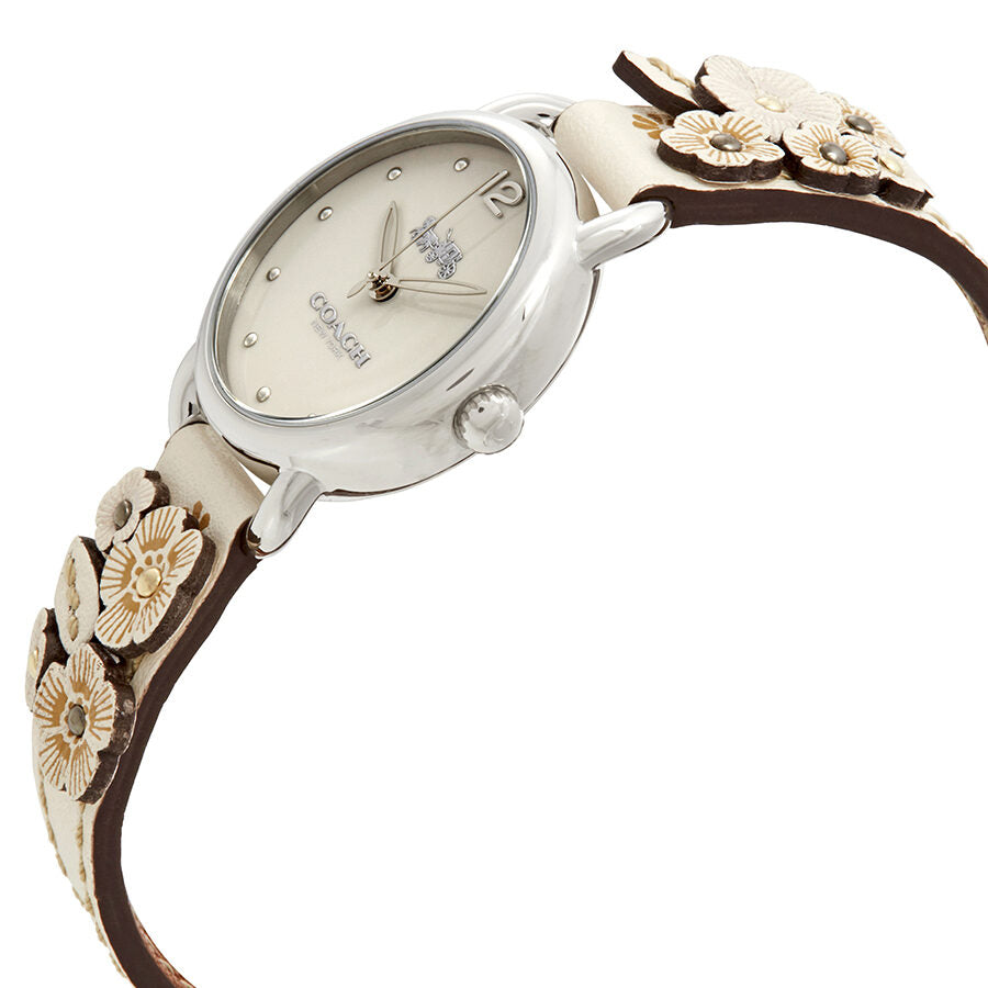 Coach Delancey watch angled view showing beige dial and decorative floral leather strap