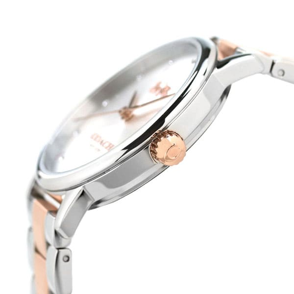 Side angle view of COACH Delancey watch showing silver and rose gold two-tone strap