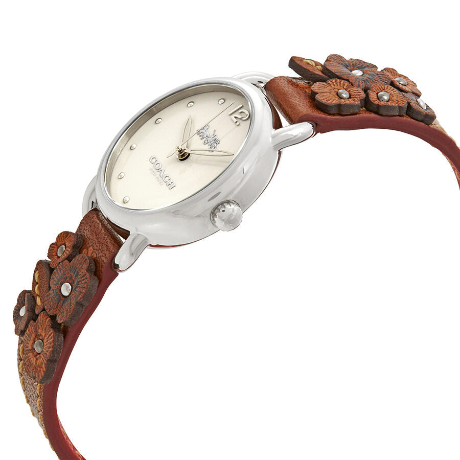Coach Delancey watch angled view showing cream beige dial and brown leather strap with embossed flowers