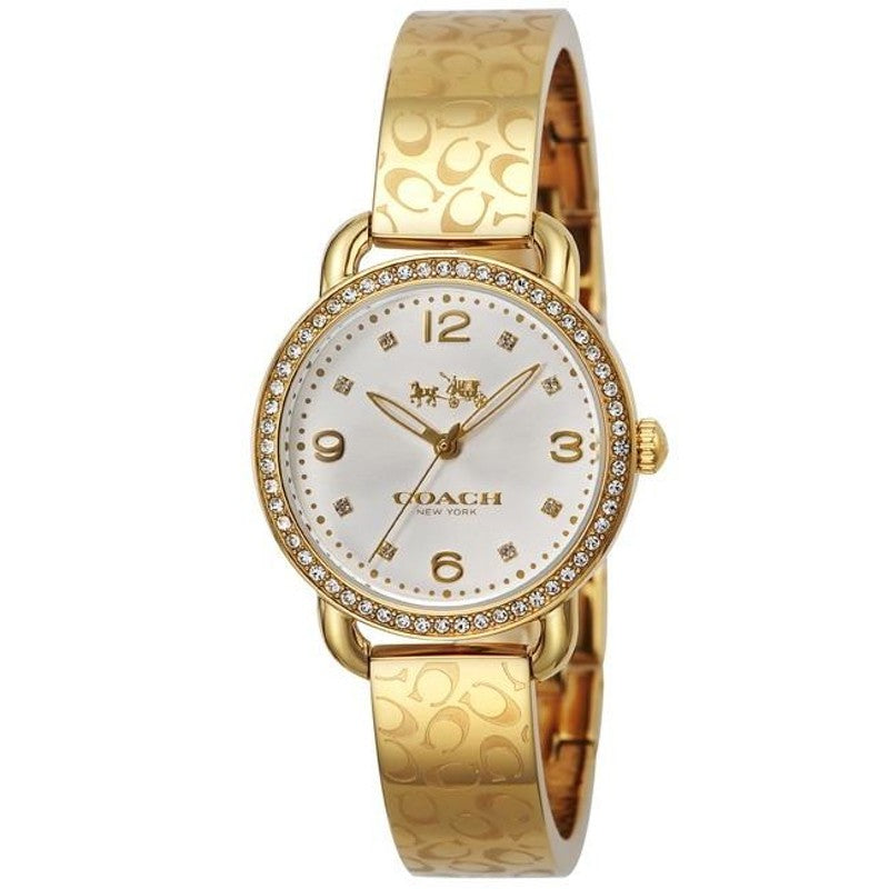 Coach Delancey Diamonds watch on wrist showing silver dial with diamond indices and gold patterned strap