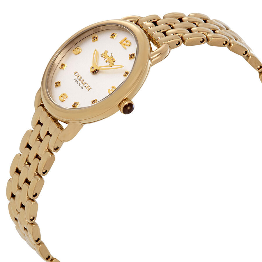 Side angle view of Coach Delancey Slim gold tone watch with silver dial and linked bracelet