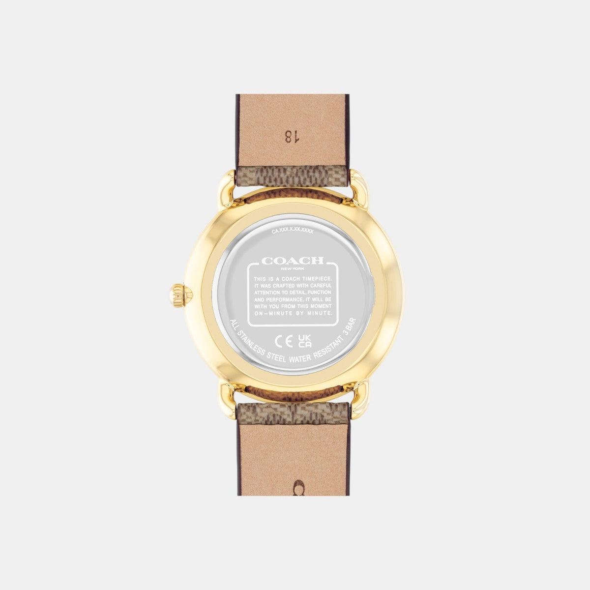 Coach Elliot watch caseback showing gold-tone case with engraved Coach branding and model details