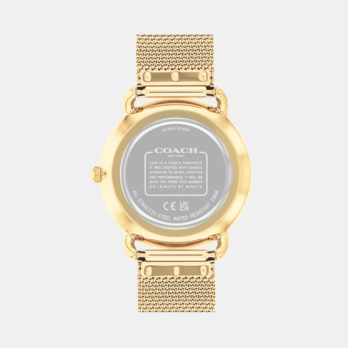 Coach Elliot watch caseback showing gold tone case and mesh bracelet