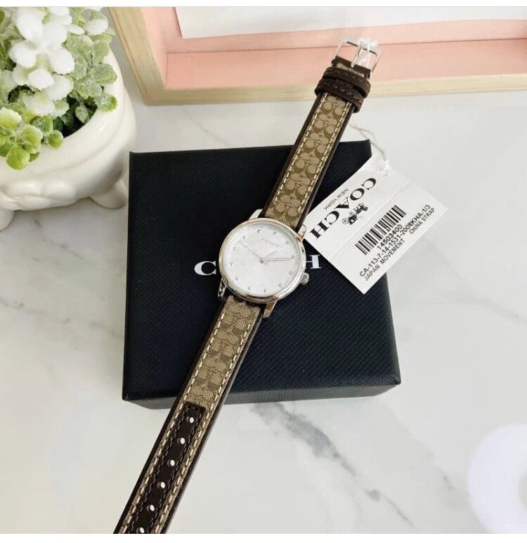 Coach Grand women's watch on wrist with Coach box and product tag displayed