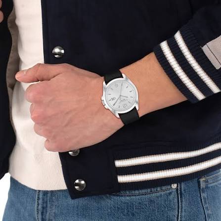 Coach Grayson watch worn on wrist with casual navy jacket and striped sweater