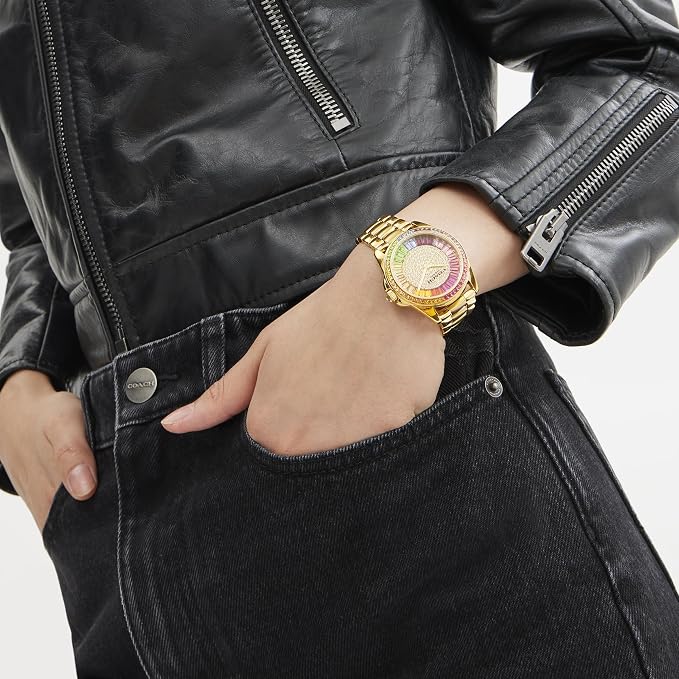 COACH Greyson watch styled on wrist with black leather jacket