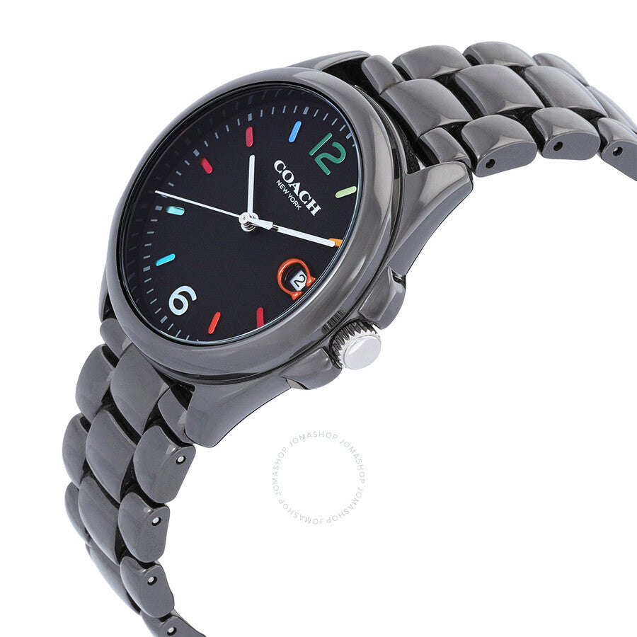 Coach Greyson watch worn on wrist showing black dial with colorful markers and gunmetal link bracelet